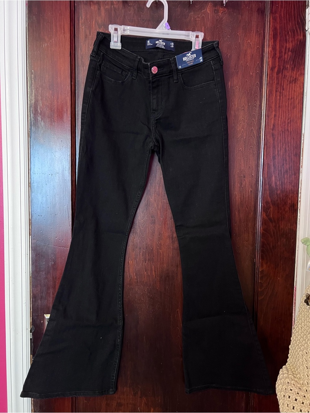 Hollister Black Flare Jeans with Pink Button Accent